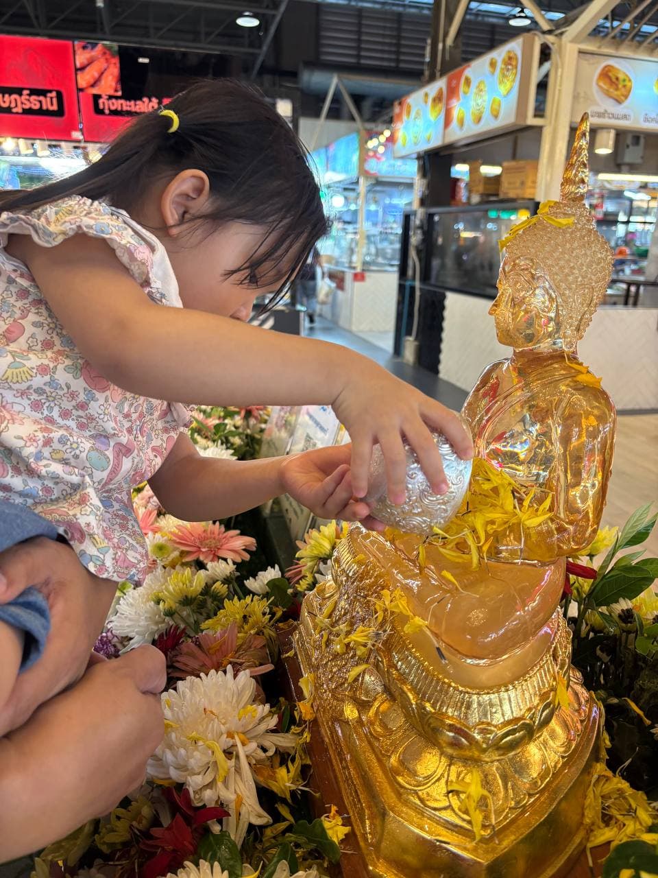 Songkran temple image with Buddha and festival detail