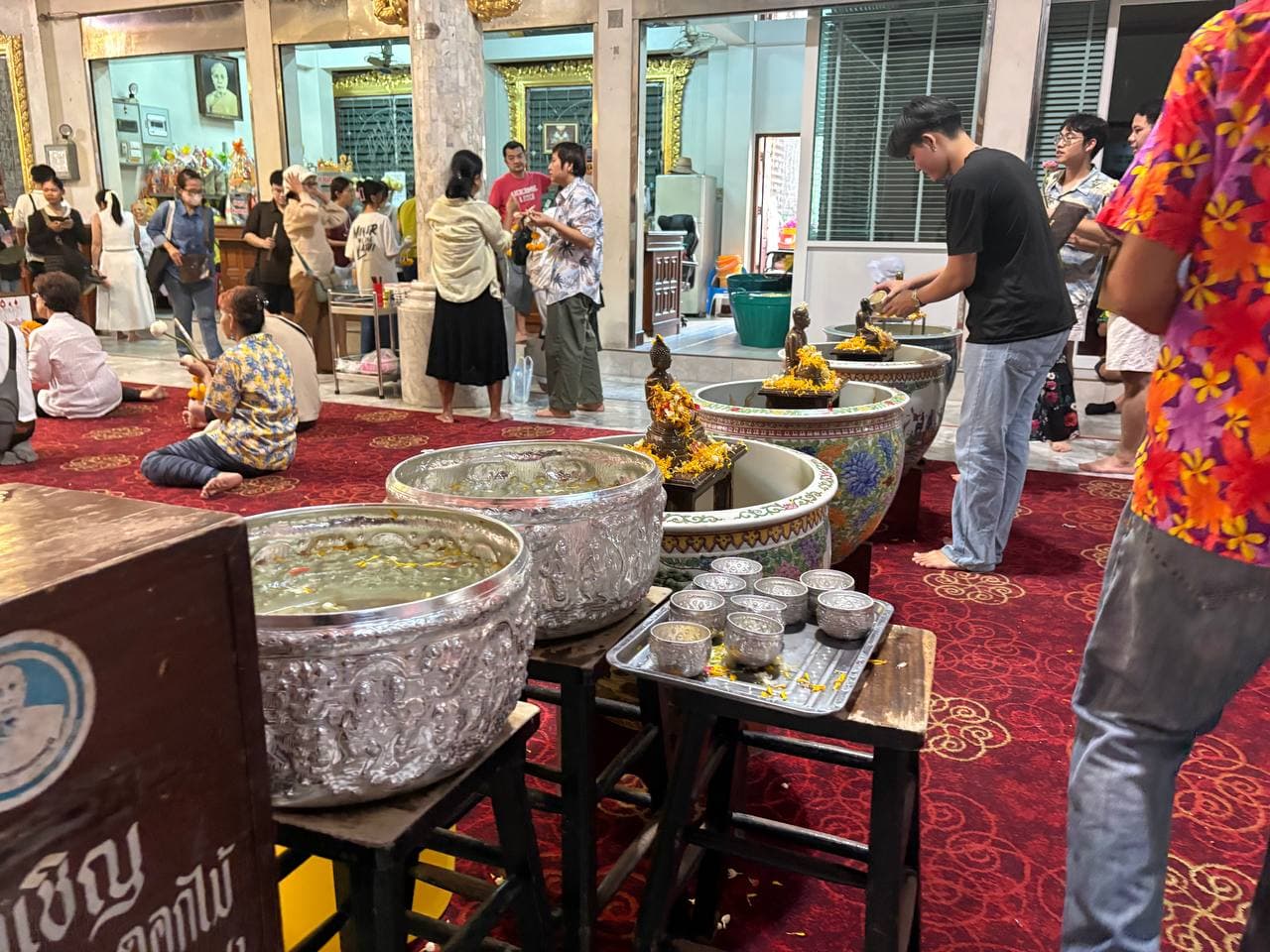 Pouring water during a Songkran ritual moment
